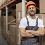 medium shot smiley man logistic warehouse