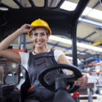 Operator/Operatorka wózka widłowego professional female industrial driver operating forklift machine factory s warehouse