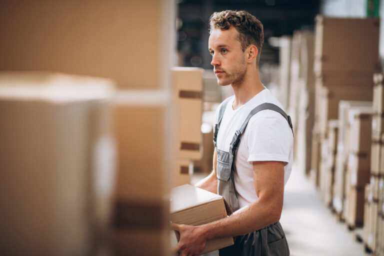 Работник/работница производства young man working warehouse with boxes 1
